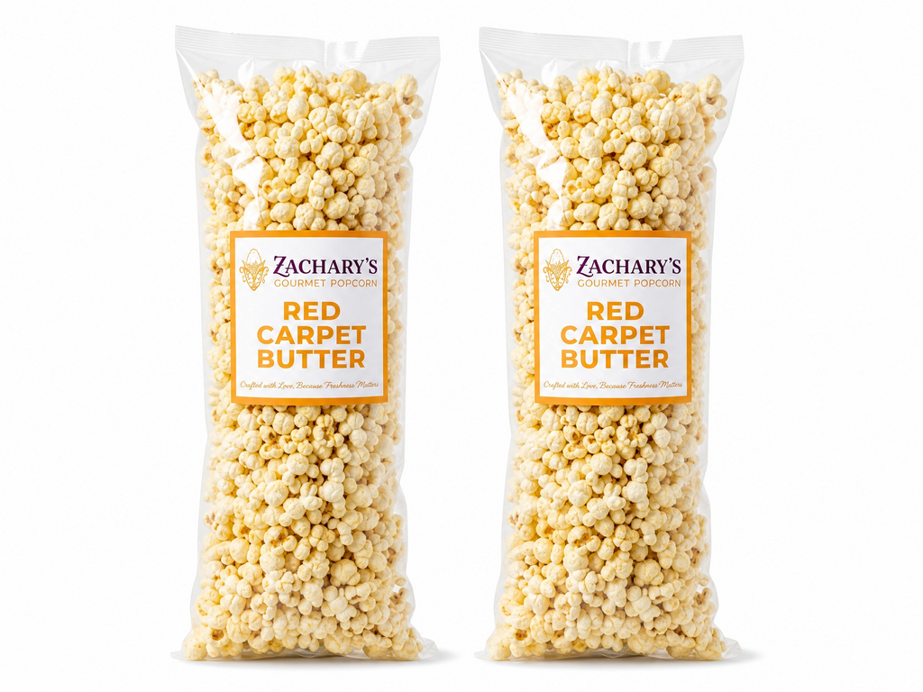 Two large bags of Zachary's Red Carpet Butter gourmet popcorn, classic golden buttery kernels with gold and white label